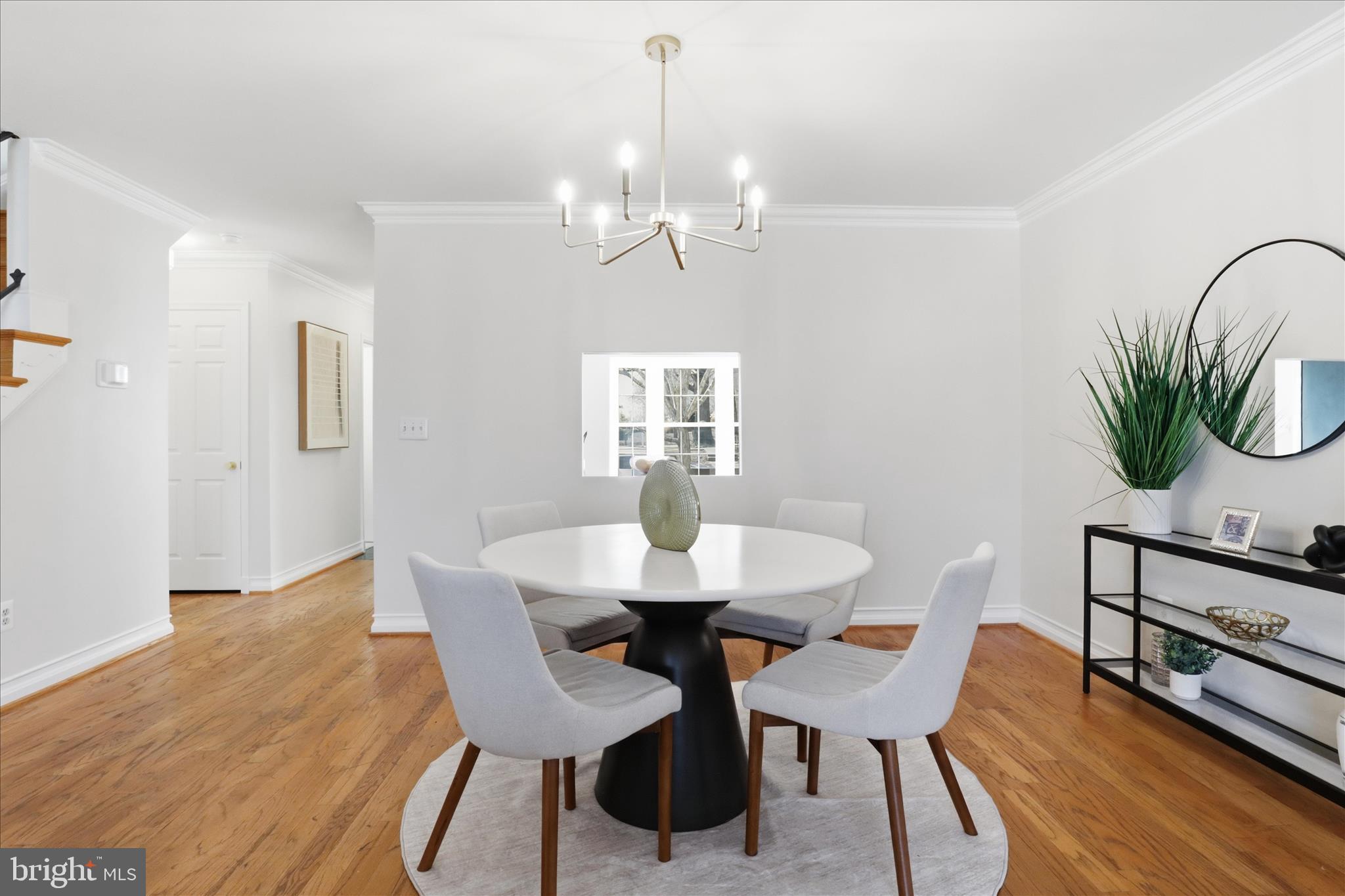 4851 Sangamore Road, Unit 25 Bethesda, MD 20816 - Photo 11 of 41 a view of a dining room with furniture and wooden floor