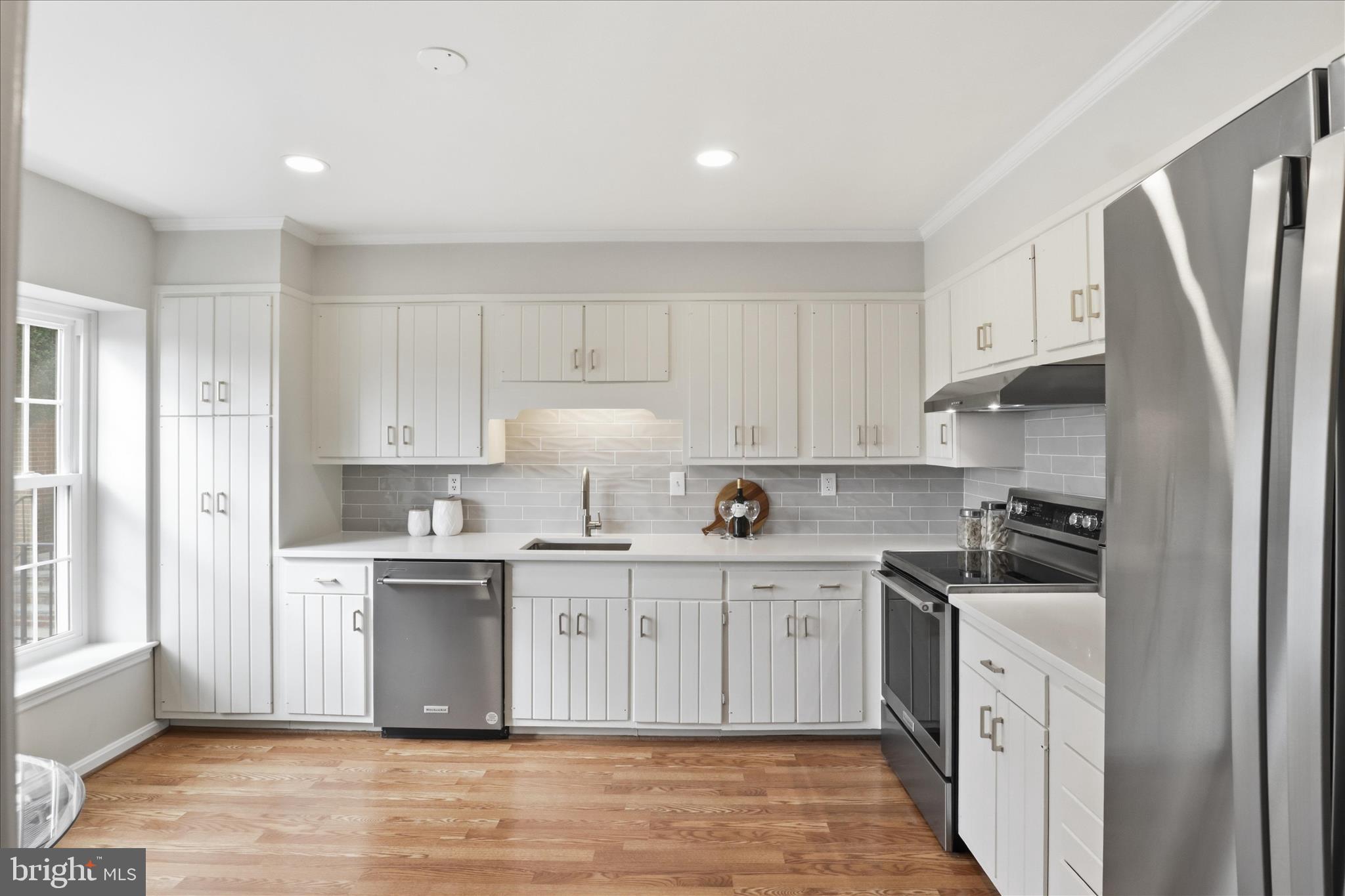 4851 Sangamore Road, Unit 25 Bethesda, MD 20816 - Photo 6 of 41 a kitchen with stainless steel appliances a sink stove refrigerator and cabinets