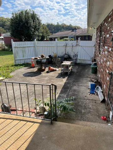 a view of backyard with a table and chairs