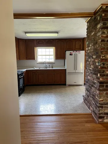 a view of entry way with wooden cabinet