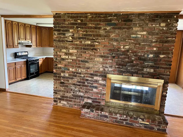 a kitchen with granite countertop sink cabinets and stainless steel appliances