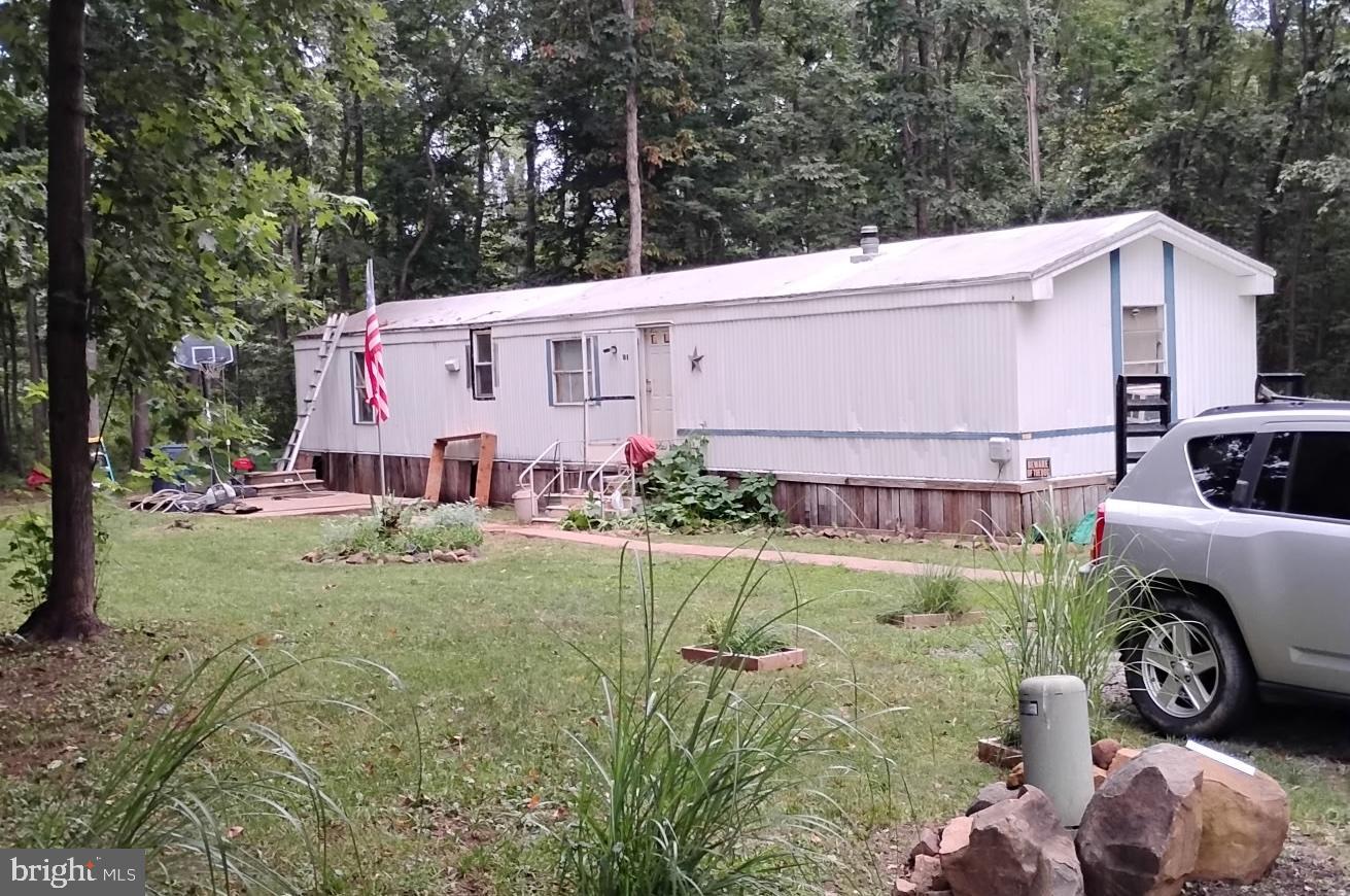 1760 Shrivers Corner Road, Unit 129 Gettysburg, PA 17325 - Photo 2 of 9 a view of a back yard of the house
