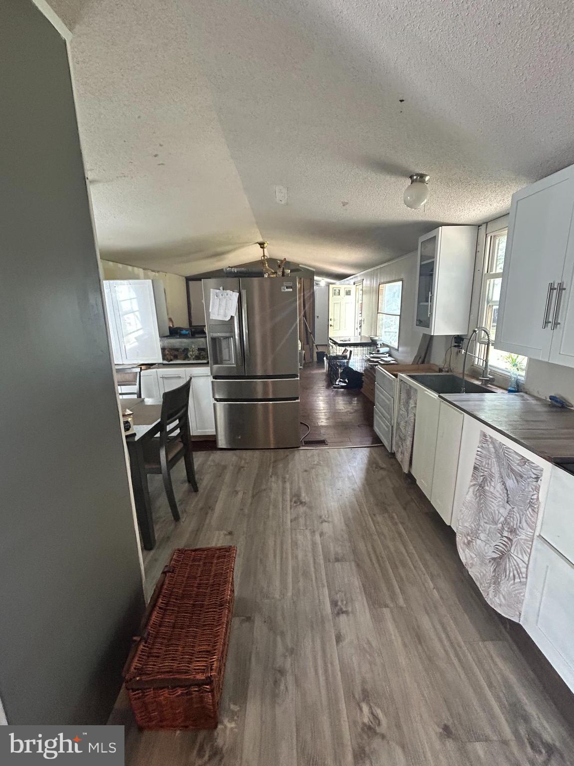 1760 Shrivers Corner Road, Unit 129 Gettysburg, PA 17325 - Photo 5 of 9 a kitchen with stainless steel appliances granite countertop a stove a sink dishwasher and a refrigerator