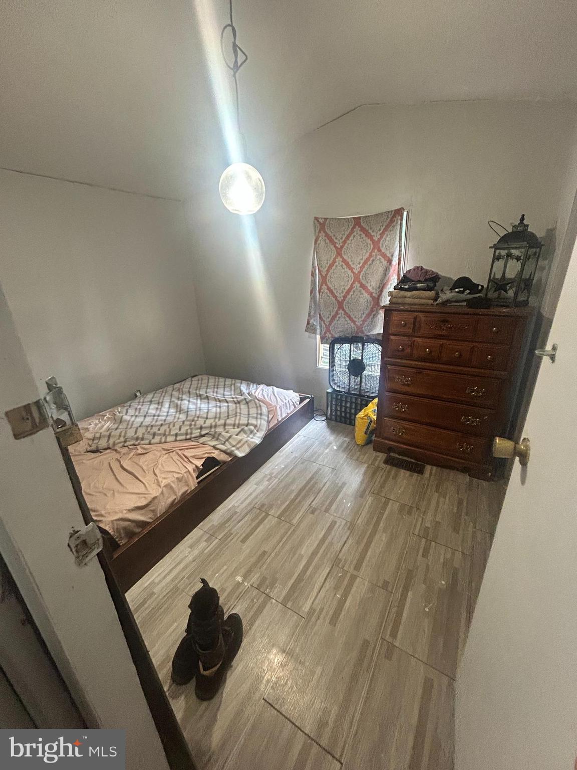 1760 Shrivers Corner Road, Unit 129 Gettysburg, PA 17325 - Photo 9 of 9 a bed sitting in a bedroom next to a window