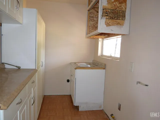 a bathroom with a sink a toilet and bathtub