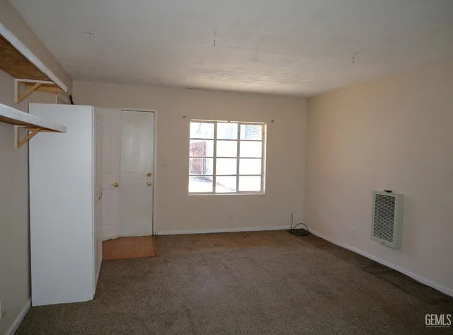 an aerial view of multiple houses with yard