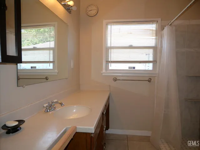 a bathroom with a sink and a window