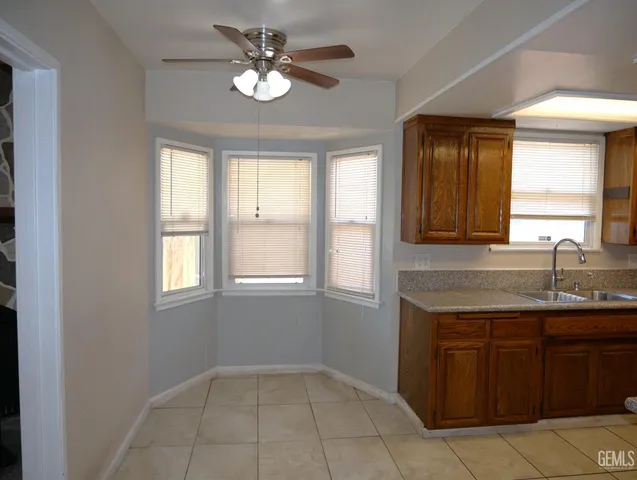 a view of a kitchen with a sink and a window