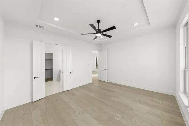 a view of a livingroom with a ceiling fan and window