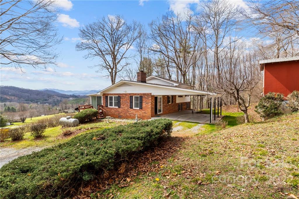 677 Monteith Branch Road Sylva, NC 28779 - Photo 3 of 48 a front view of a house with a yard