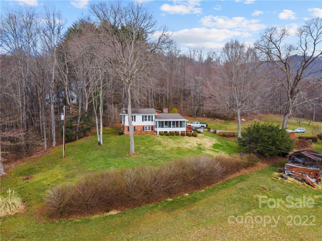 677 Monteith Branch Road Sylva, NC 28779 - Photo 45 of 48 a view of a house with backyard and sitting area