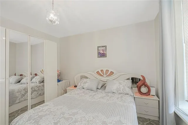 a bedroom with a bed and cabinets