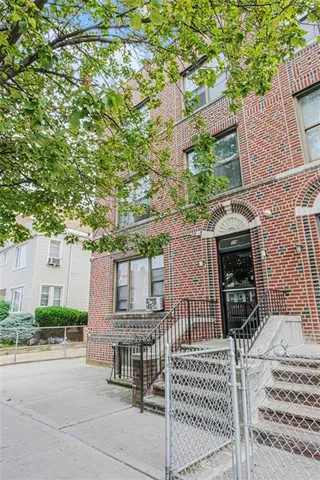 a view of a house with a tree
