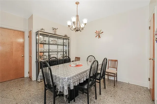 a view of a dining room with furniture and window