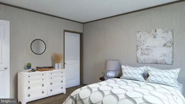 a bedroom with a bed and dresser