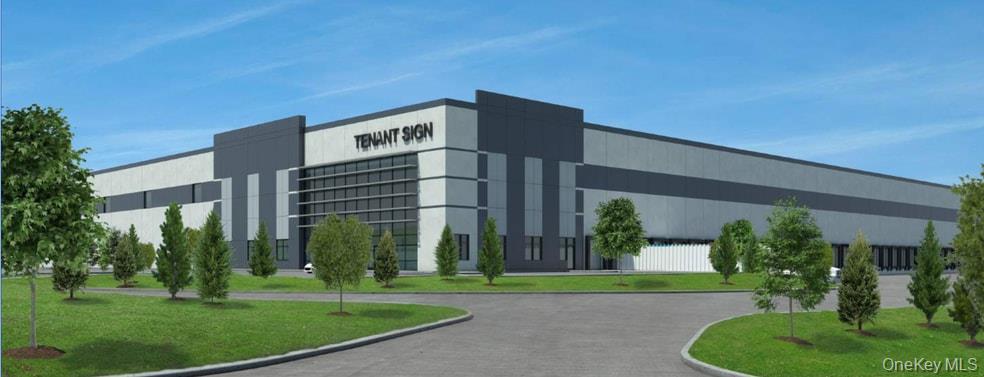 a front view of a building with a garden