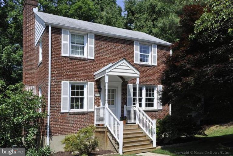 11710 Lytle Street Silver Spring, MD 20902 - Photo 1 of 30 a front view of a house with a yard