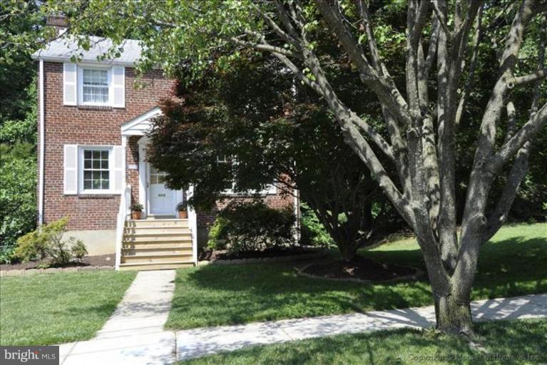 11710 Lytle Street Silver Spring, MD 20902 - Photo 22 of 30 a front view of a house with garden