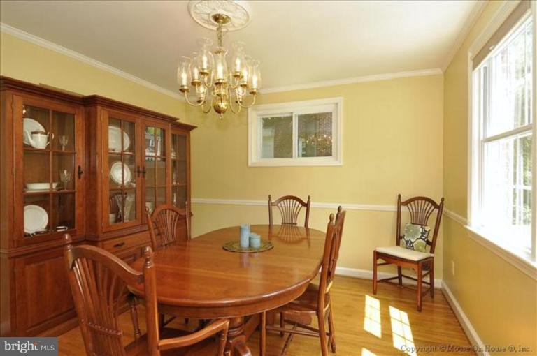 11710 Lytle Street Silver Spring, MD 20902 - Photo 4 of 30 a dining room with furniture a chandelier and window