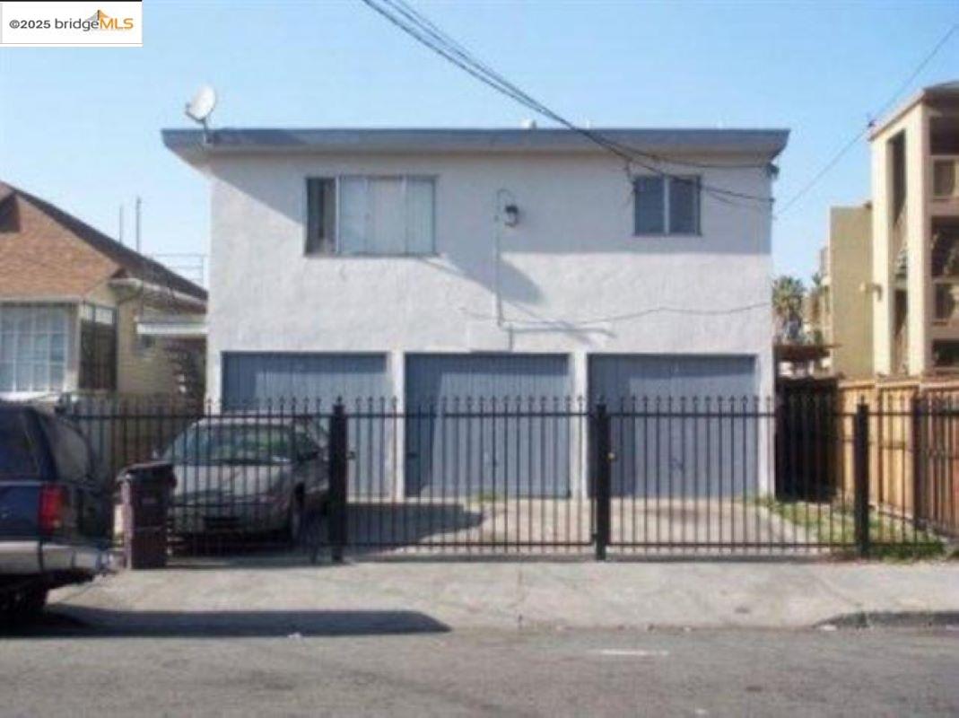 a view of a house with wooden fence