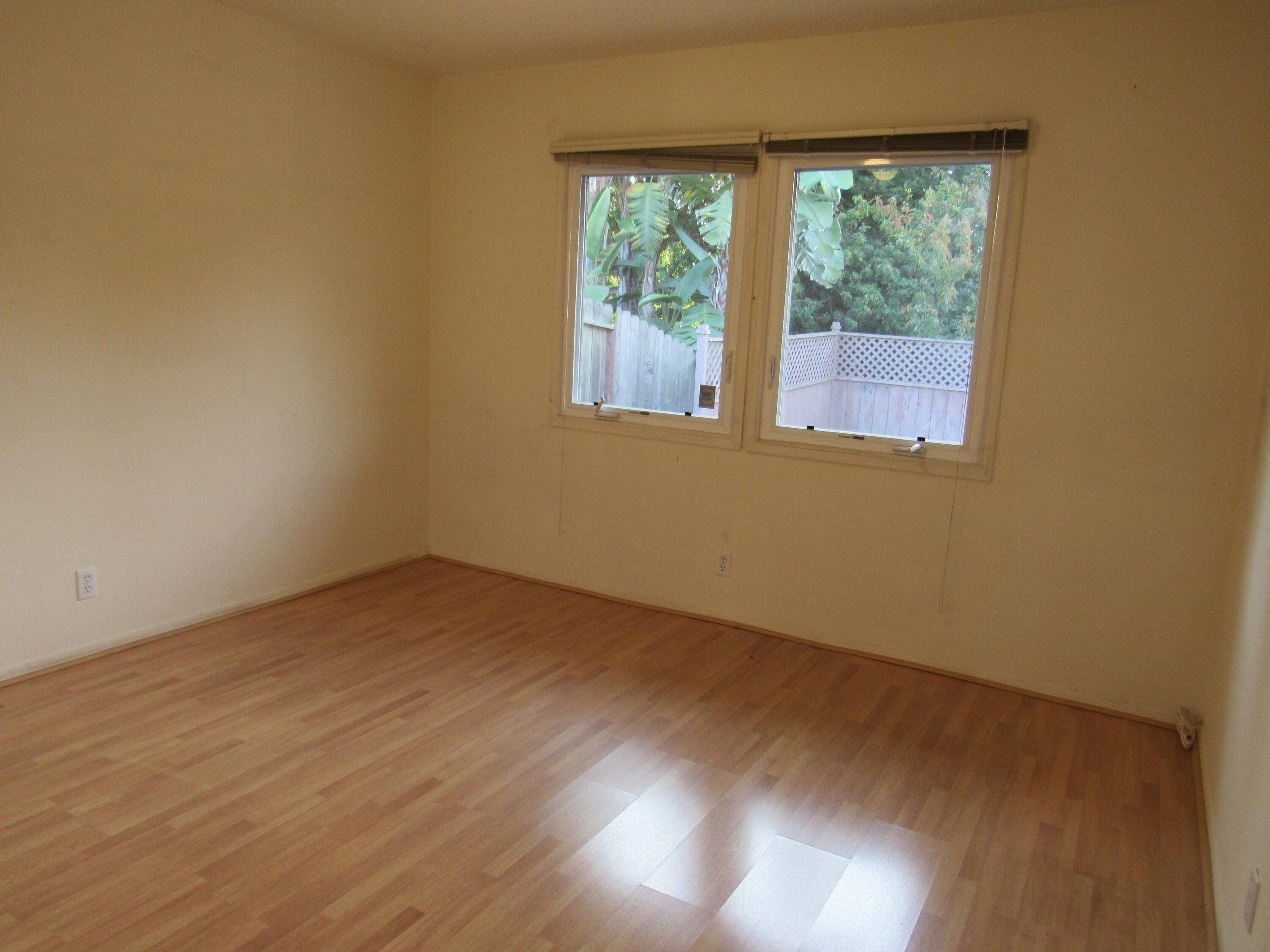 343 Salida Del Sol Santa Barbara, CA 93109 - Photo 11 of 20 a view of an empty room with wooden floor and a window
