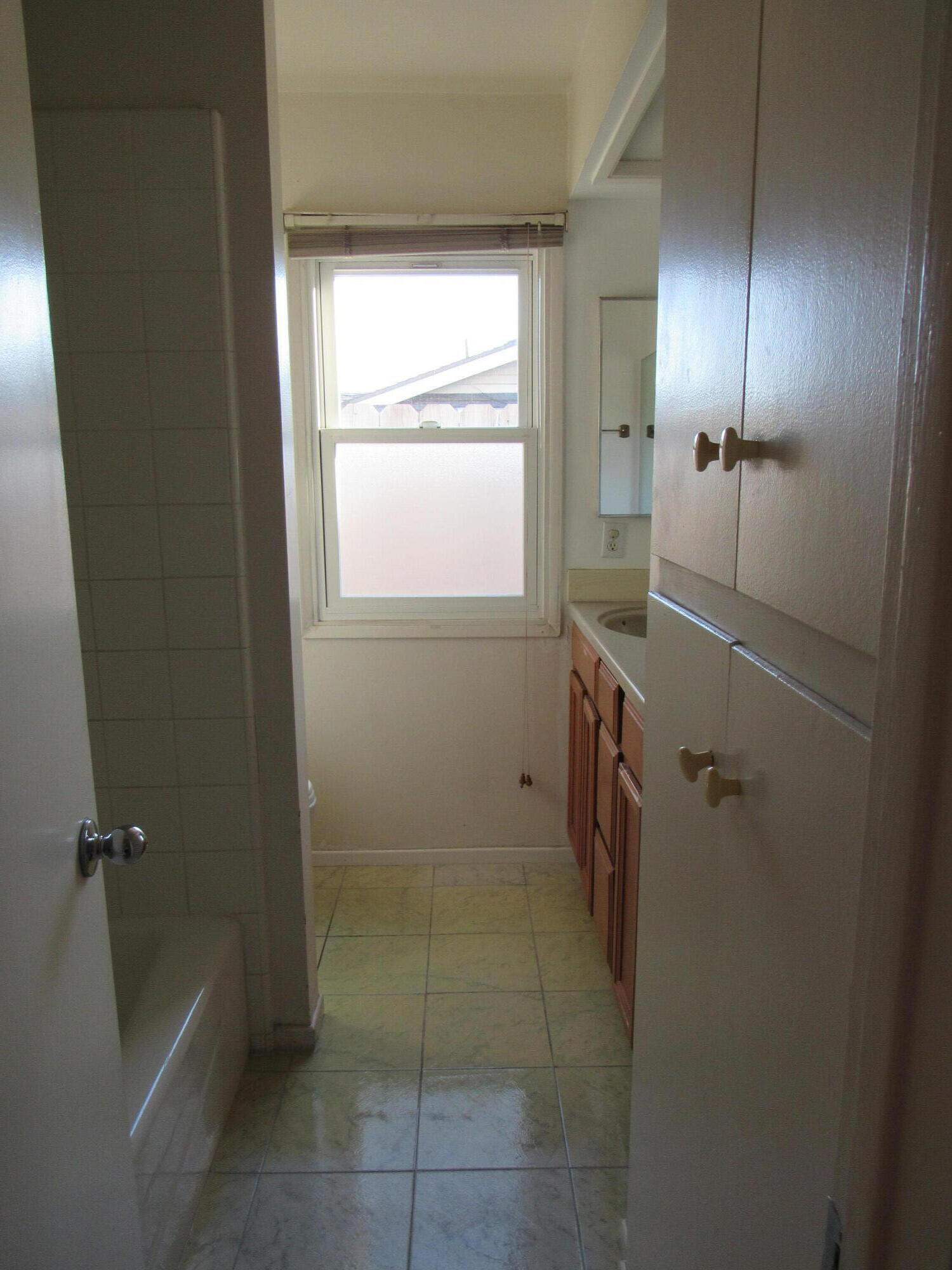 343 Salida Del Sol Santa Barbara, CA 93109 - Photo 13 of 20 a bathroom with a granite countertop sink a toilet and shower