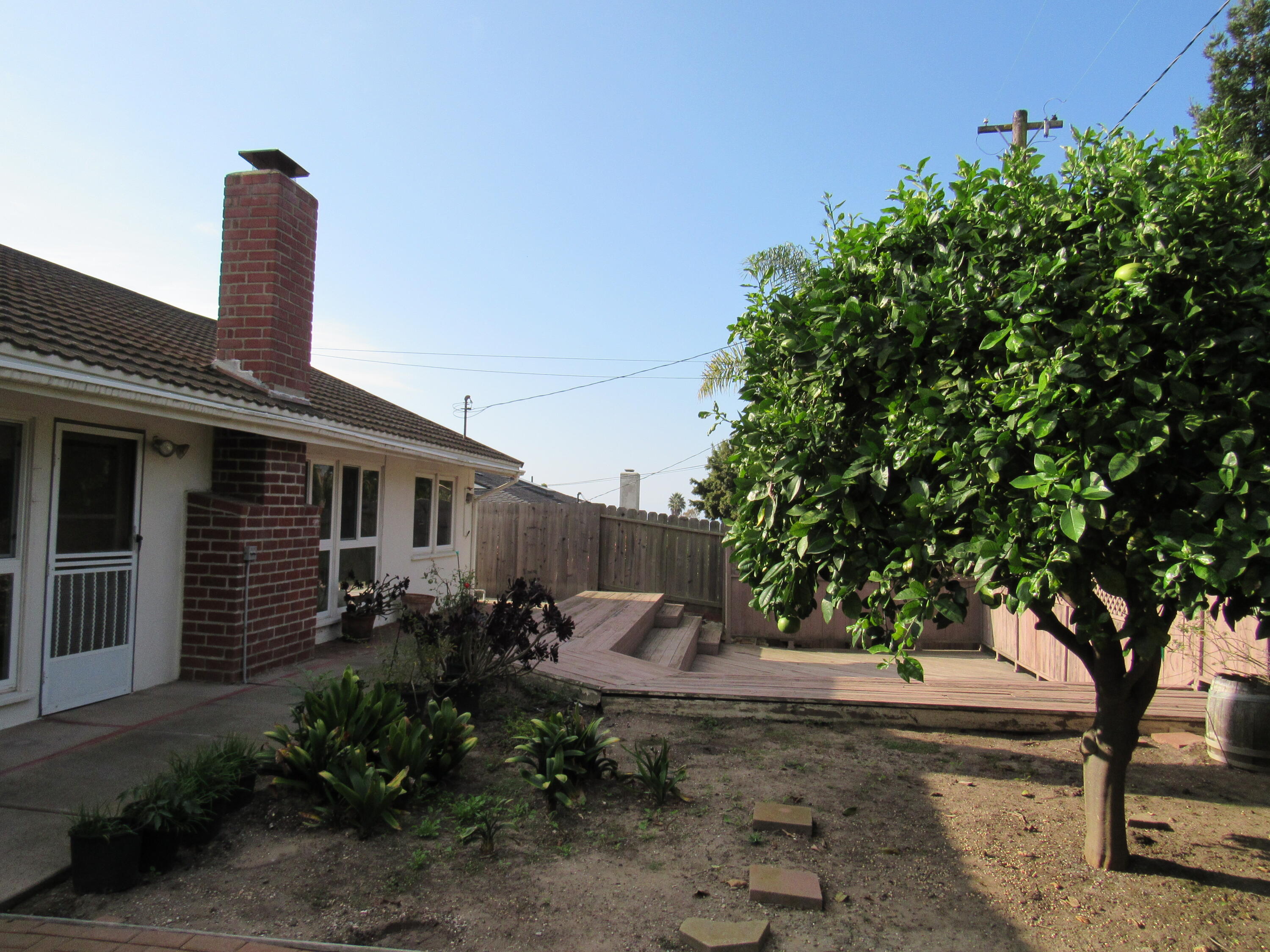 343 Salida Del Sol Santa Barbara, CA 93109 - Photo 20 of 20 a backyard of a house with lots of green space