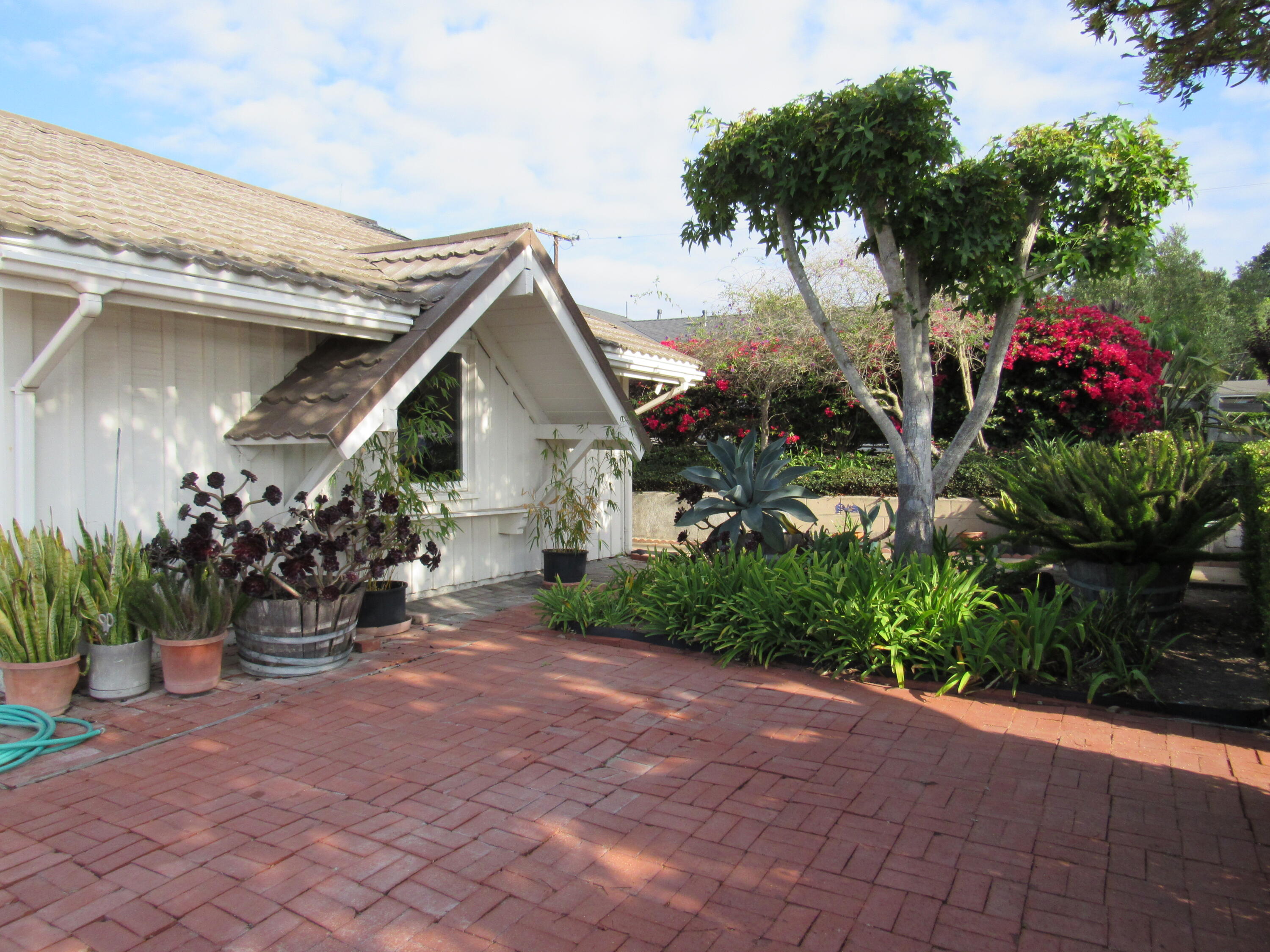 343 Salida Del Sol Santa Barbara, CA 93109 - Photo 3 of 20 a man is sitting in front of a house
