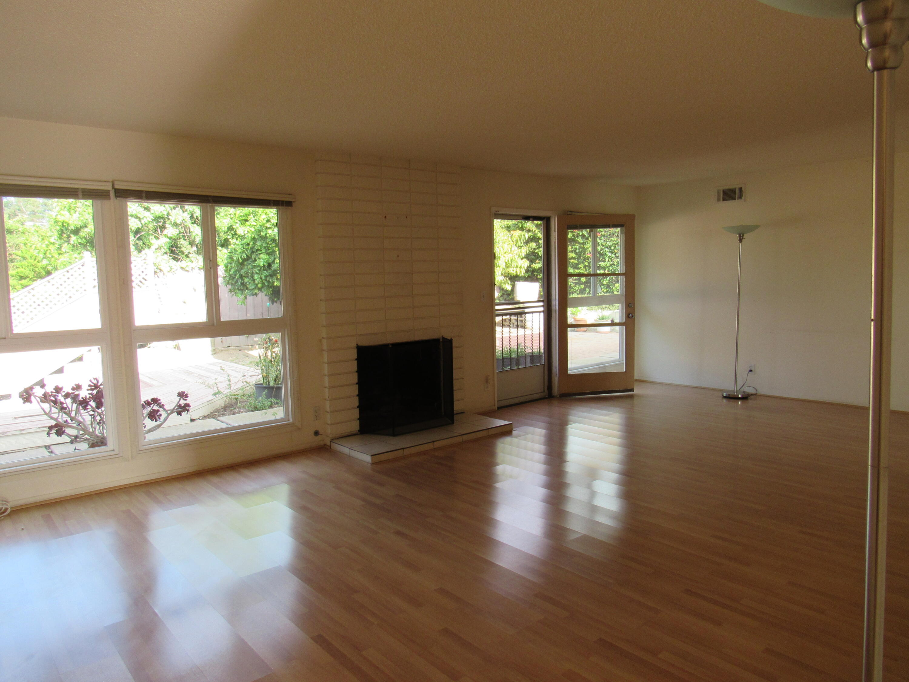 343 Salida Del Sol Santa Barbara, CA 93109 - Photo 5 of 20 a view of an empty room with wooden floor and a window
