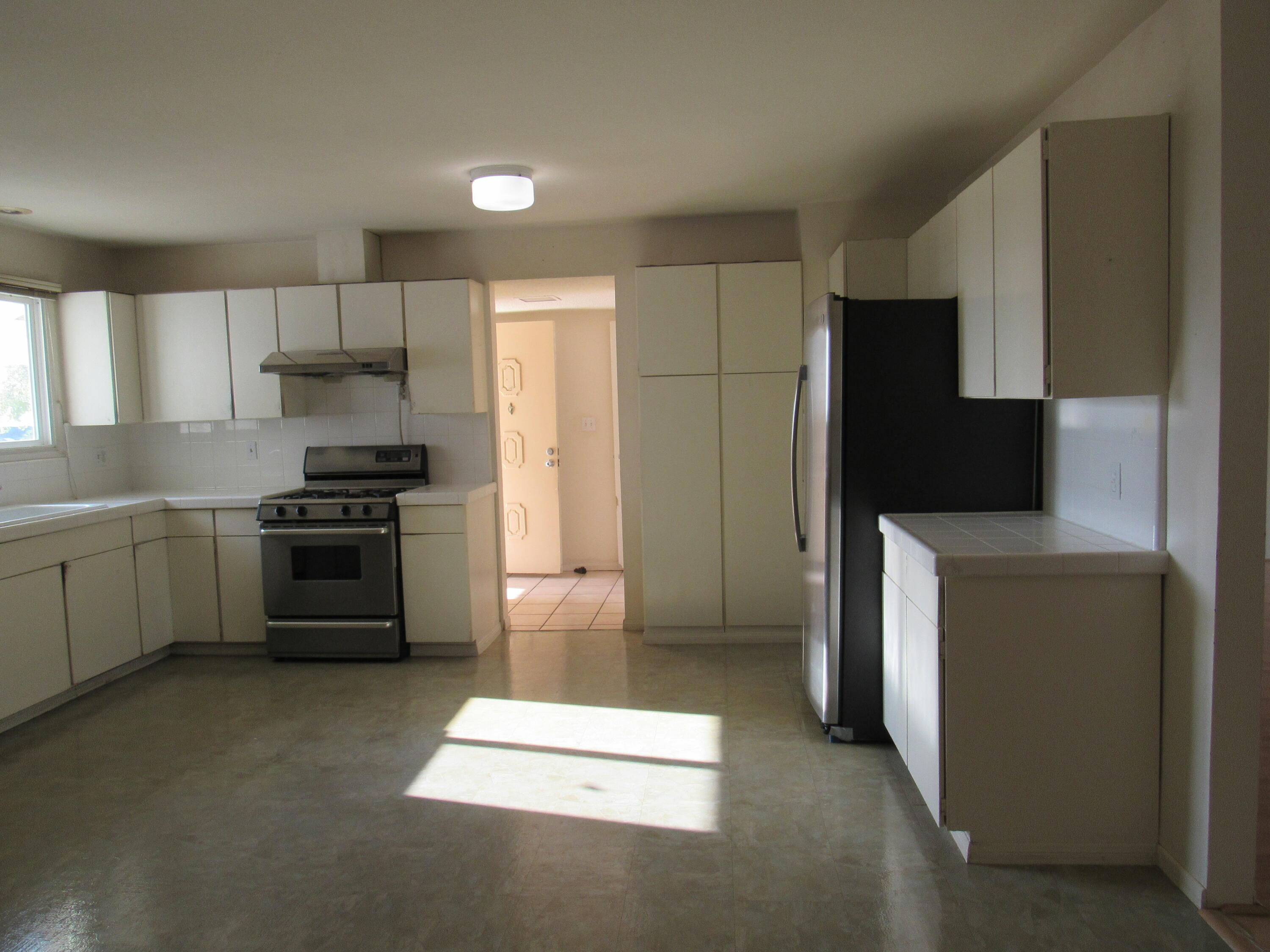 343 Salida Del Sol Santa Barbara, CA 93109 - Photo 8 of 20 a kitchen with cabinets and stainless steel appliances