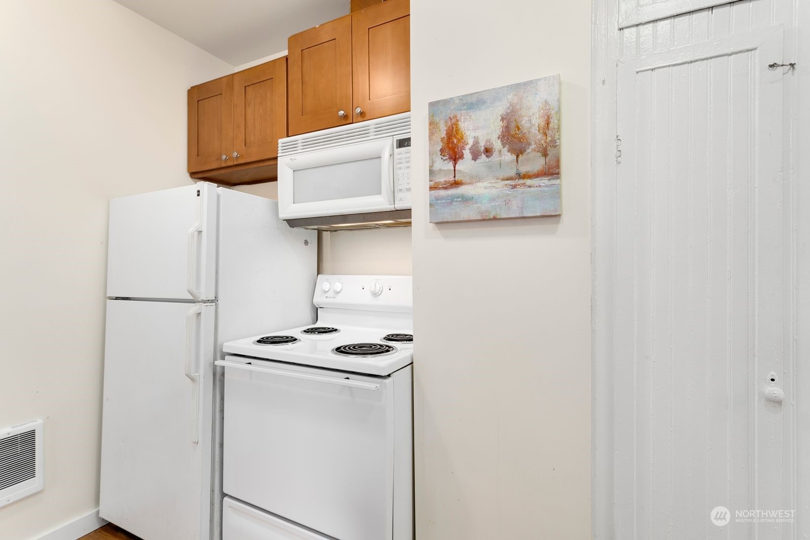 2808 Southwest Genesee Street Seattle, WA 98126 - Photo 27 of 29 a white refrigerator freezer sitting inside of a kitchen
