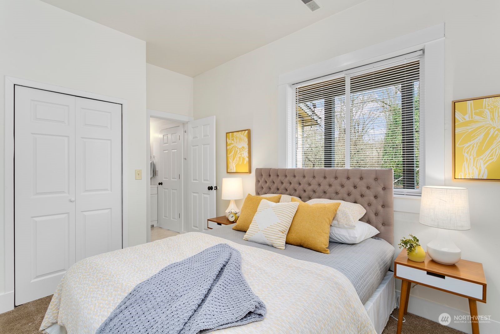 2808 Southwest Genesee Street Seattle, WA 98126 - Photo 4 of 29 a bedroom with a bed and wooden floor