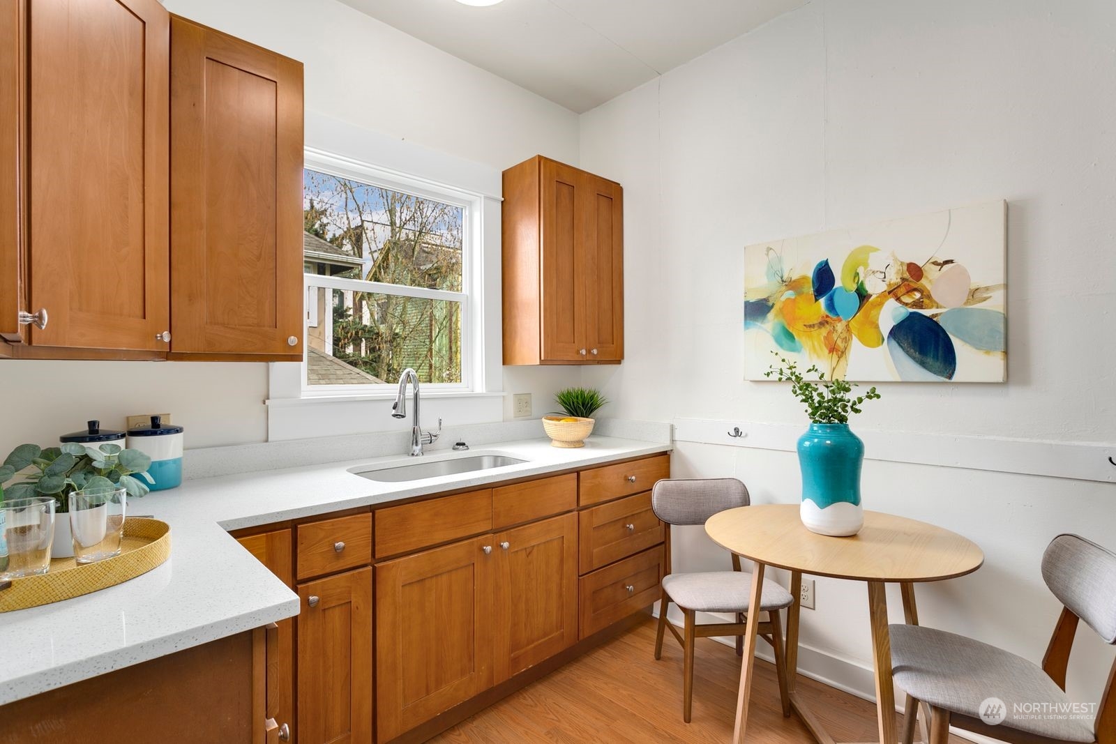 2808 Southwest Genesee Street Seattle, WA 98126 - Photo 8 of 29 a kitchen with a sink cabinets and a table