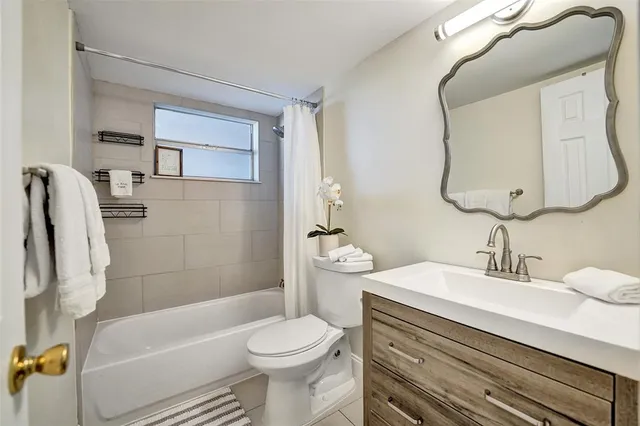a view of a balcony with wooden floor and furniture
