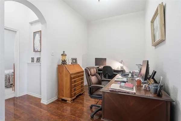 a workspace with furniture and wooden floor