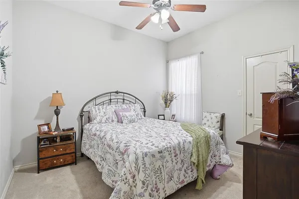a bedroom with a bed and a television