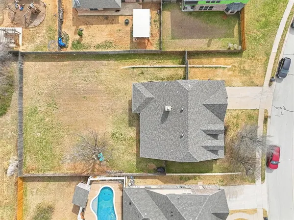 an aerial view of residential houses with outdoor space