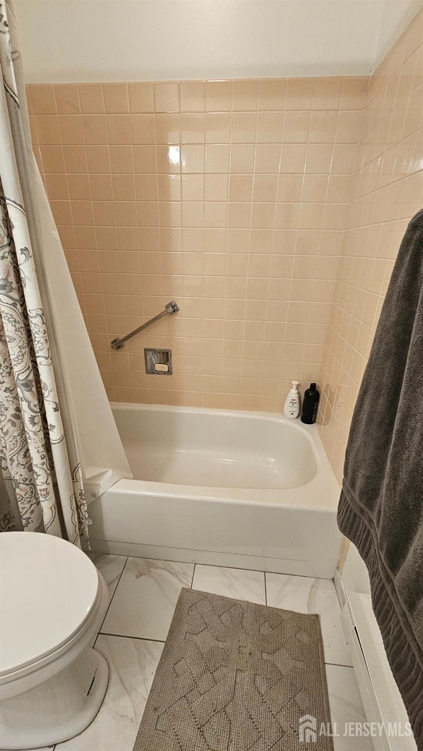 449 B Closter Road, Unit B Monroe Township, NJ 08831 - Photo 6 of 14 a bathroom with a toilet and a bathtub