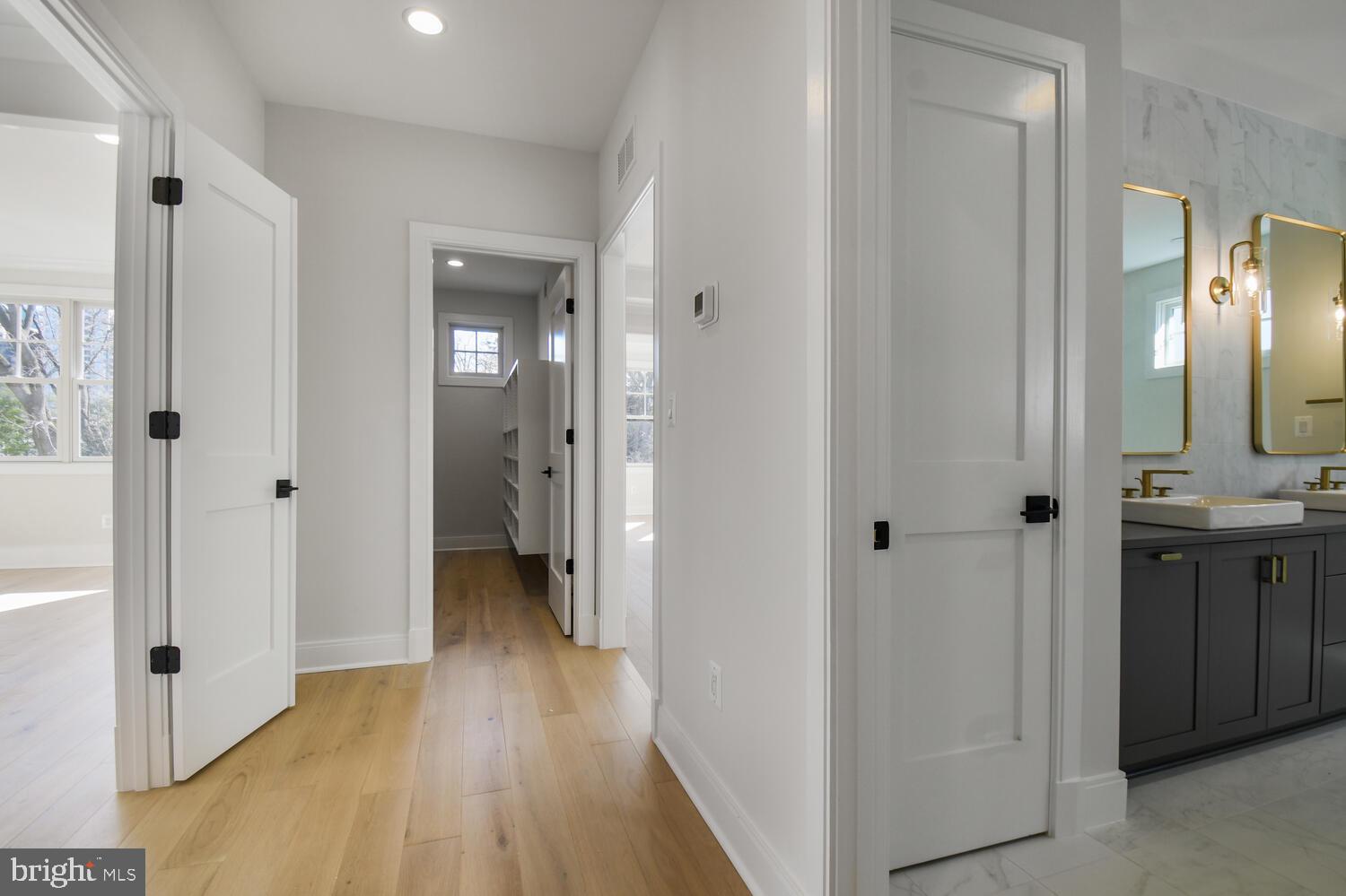 7819 Exeter Road Bethesda, MD 20814 - Photo 19 of 38 Entrances to Primary Suite Bathroom & Closets