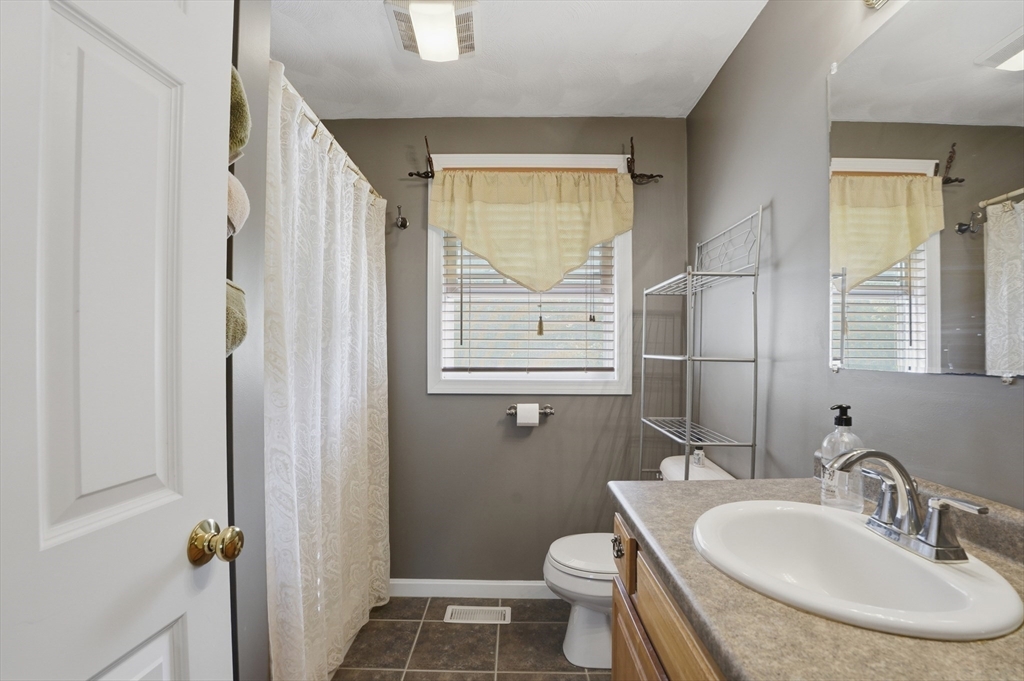 160 Gray Road Templeton, MA 01468 - Photo 28 of 42 a bathroom with a sink toilet a mirror and shower
