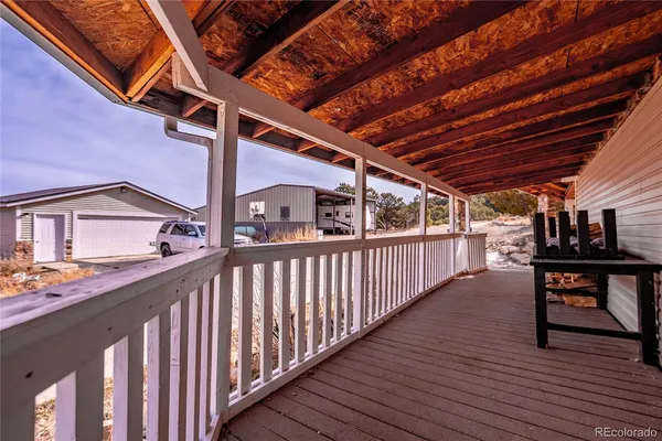 a view of deck with wooden floor and seating space