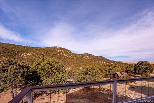 a view of a mountain from a balcony