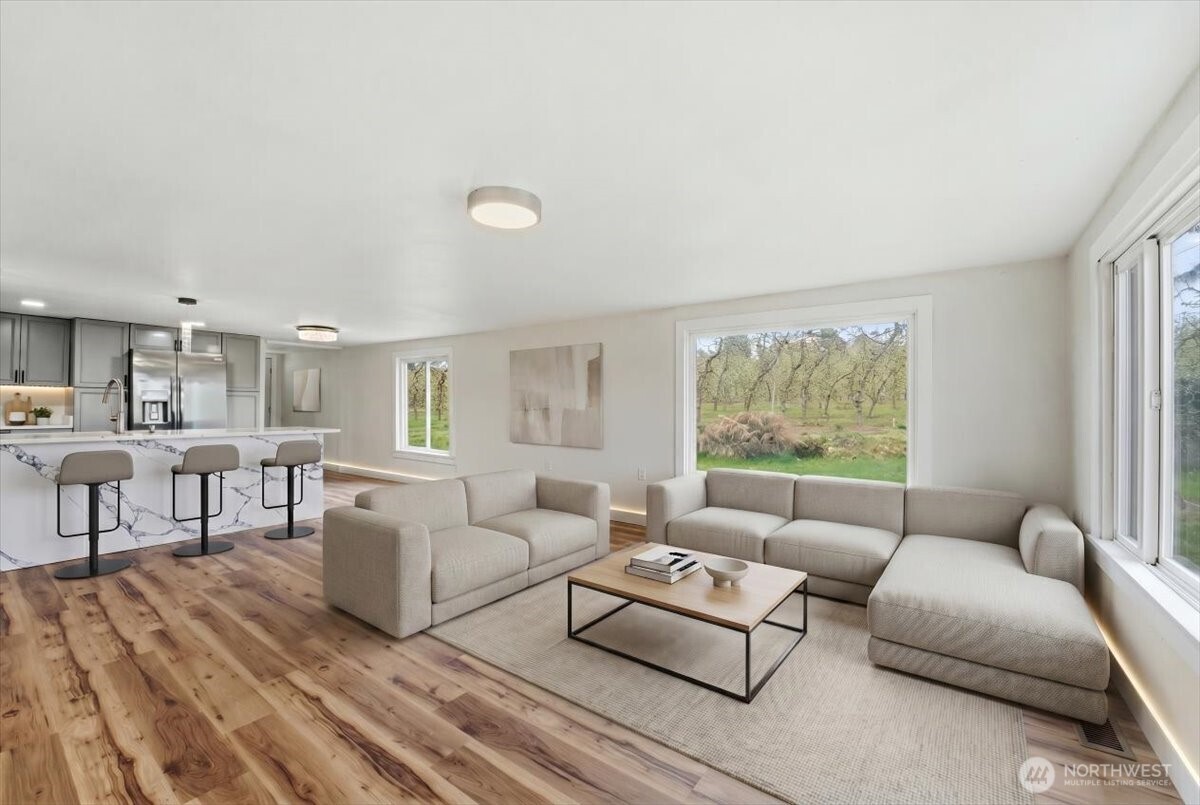 293 Barkley Road Manson, WA 98831 - Photo 5 of 40 a living room with furniture and a large window