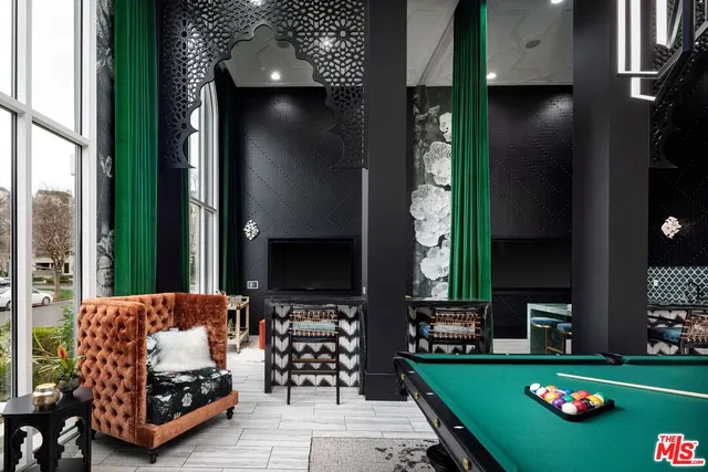 a view of a room that has a table and chairs in it