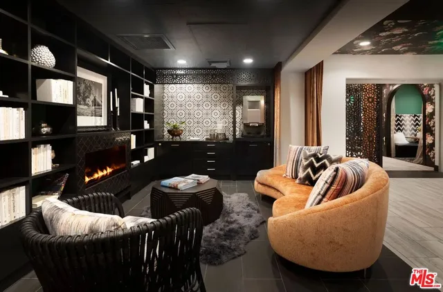 a outdoor living space with furniture and a fireplace