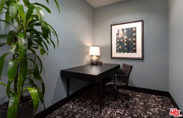 a room with gym equipment and a flat screen tv