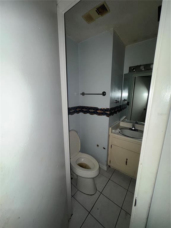11001 Southeast Sunset Harbor Road, Unit D21 Summerfield, FL 34491 - Photo 10 of 15 a bathroom with a toilet and a sink
