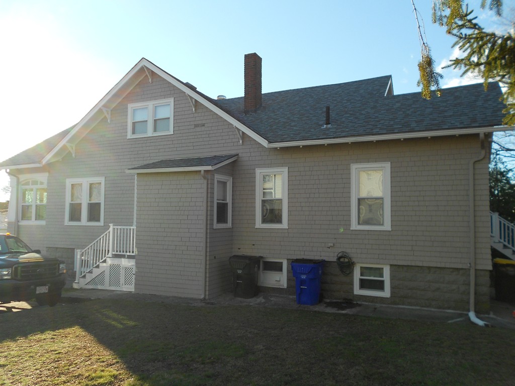 682 Tucker Street Fall River, MA 02721 - Photo 3 of 7 a front view of a house with a yard