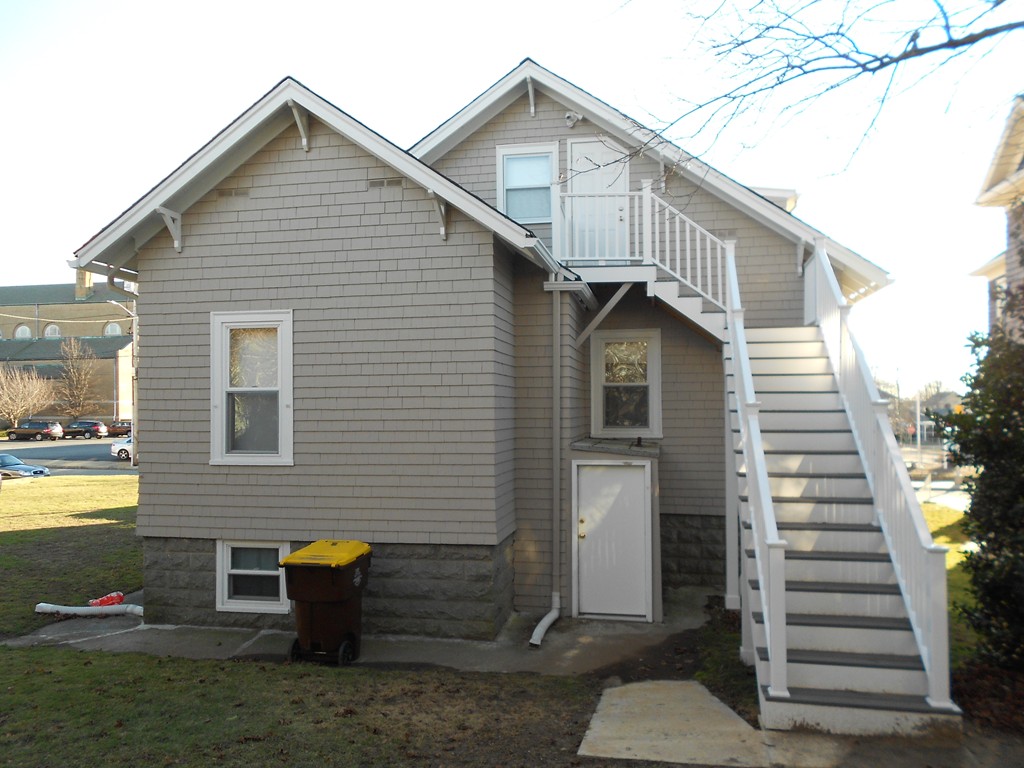 682 Tucker Street Fall River, MA 02721 - Photo 4 of 7 a view of a house with backyard