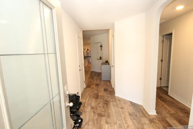 a view of a bathroom from a hallway